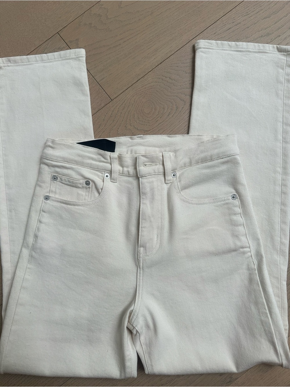 Off-White High-Rise Jeans with Black Leather Tag